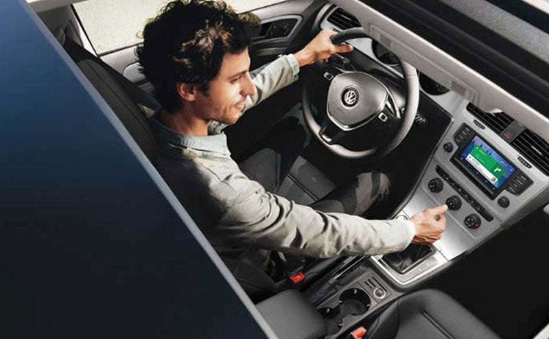 Man driving a Volkswagen vehicle image